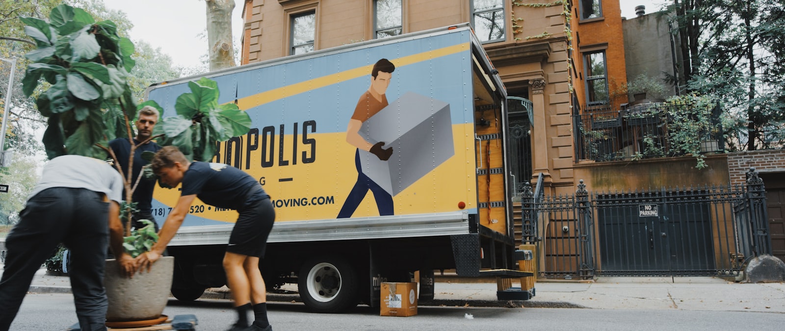 A Homepac Express crew carefully packing household goods into labelled boxes